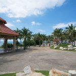 resting area with seating and palm trees