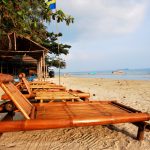 Wooden beach chairs on beach